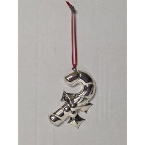 silver-plated Christmas ornament shaped like a candy cane with a holly design